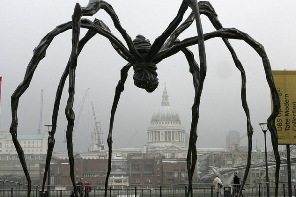 FILE - In this Oct. 3, 2007 file photo, French-born artist Louise Bourgeois' sculpture of a giant spider, Maman 1999, stands outside the Tate Modern in London. The sculpture, one of a series of six, is more than nine metres high and made of bronze, stainless steel and marble. Her studio's managing director says artist Louise Bourgeois has died in New York City, after a lengthy career of exploring women's deepest feelings on birth, sexuality and death. She was 98. Wendy Williams of Louise Bourgeois Studio says the sculptor died at Beth Israel Medical Center on Monday, May 31, 2010 two days after suffering a heart attack.  (AP Photo/Nathan Strange, File) === OCT 3 2007 FILE PHOTO ===